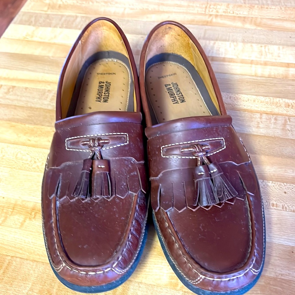 Johnson and Murphy leather tassel loafer with rubber sole. Worn once great shape